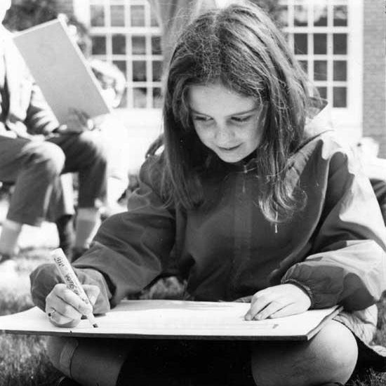 Lily Casura as a child, writing, featured in a local newspaper